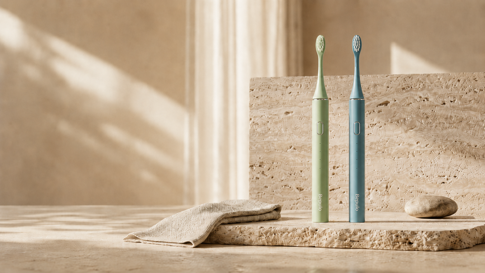 Two green electric toothbrushes on a stone surface with a neutral background