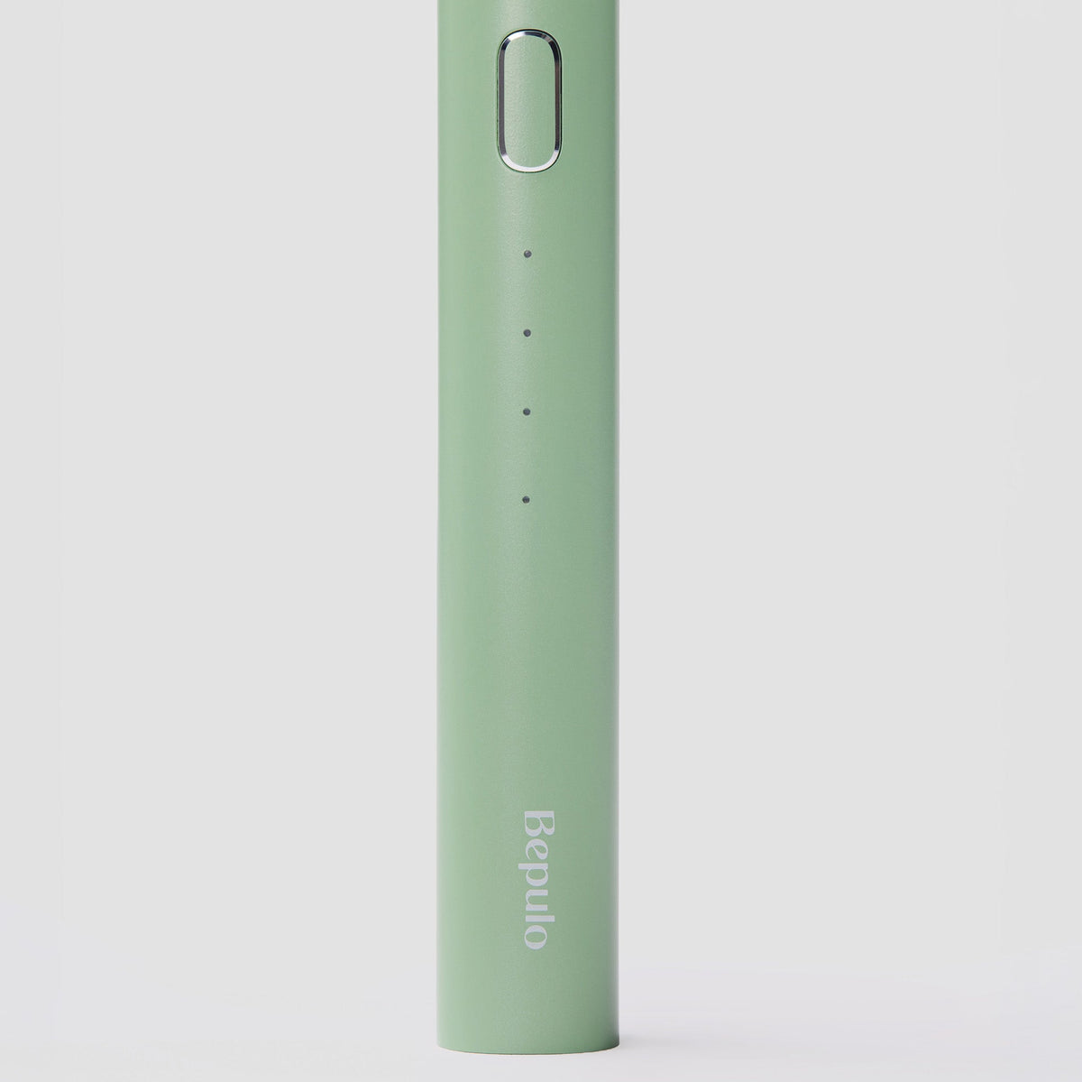 Close-up of Bepulo Next pistachio green sonic electric toothbrush alloy handle.