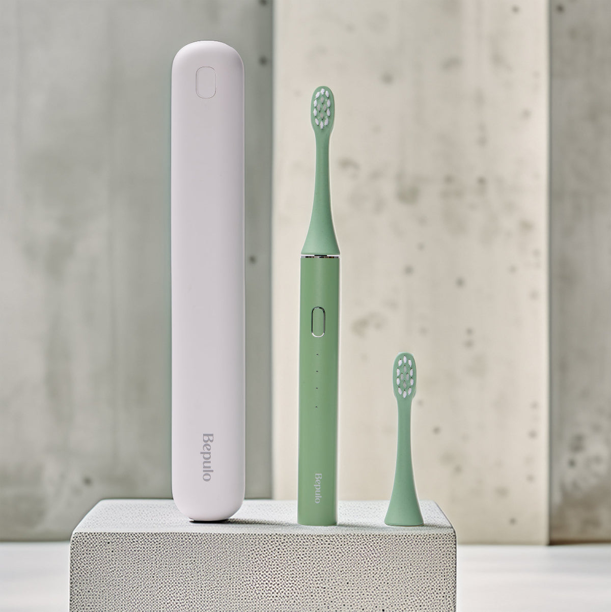 Bepulo Next sonic electric toothbrush travel set in pistachio green with a white travel case and replacement head. #colour_pistachio green