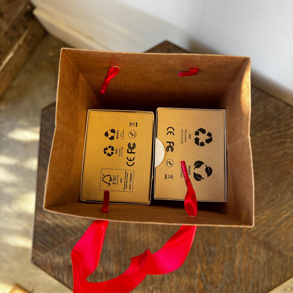 A top down view of a Bepulo xmas gift wrapping bag with 2 Bepulo packages inside. 