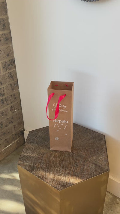 A video of a Bepulo gift bag standing on a small table